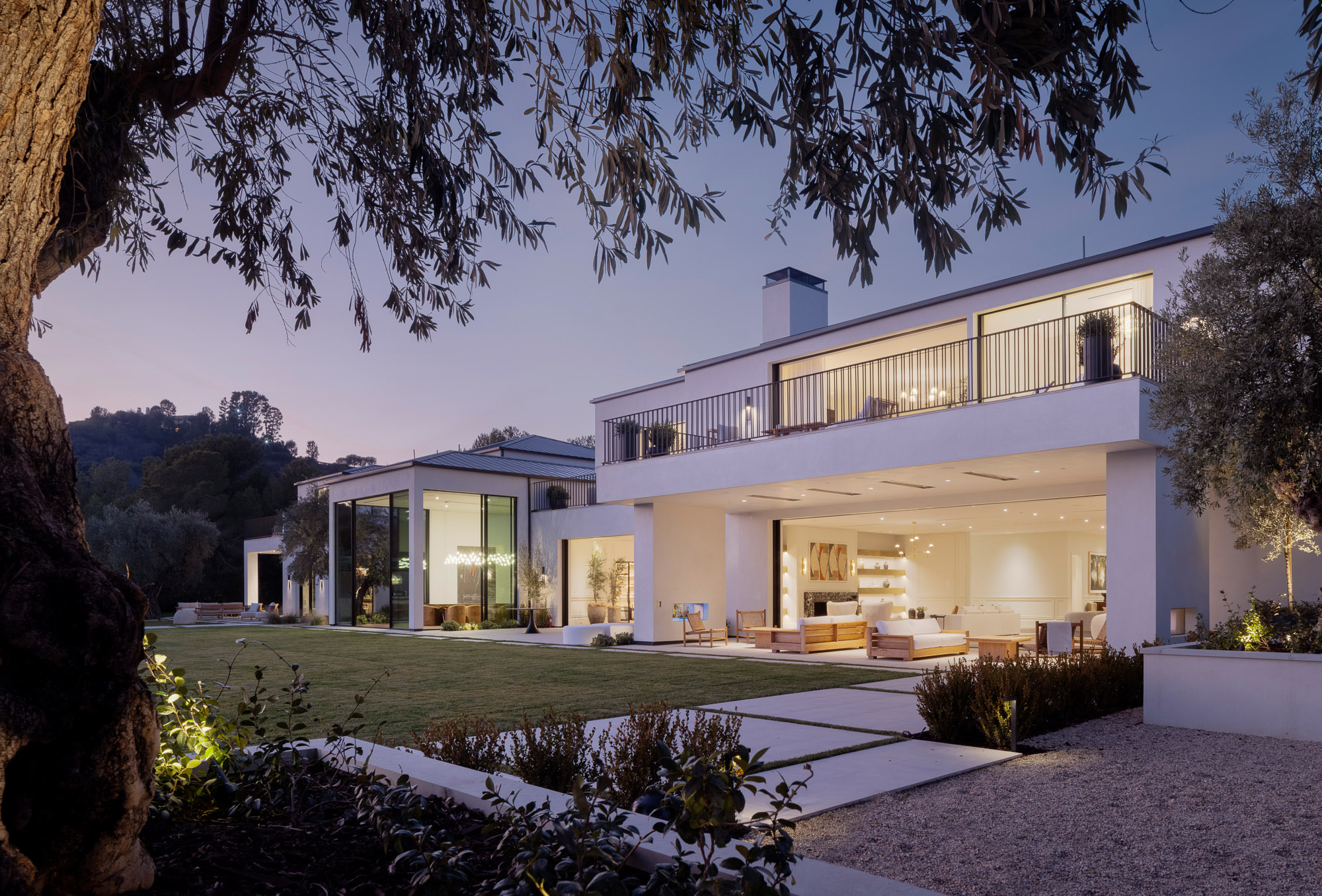 A Grade development at twilight, seen from the rear elevation
