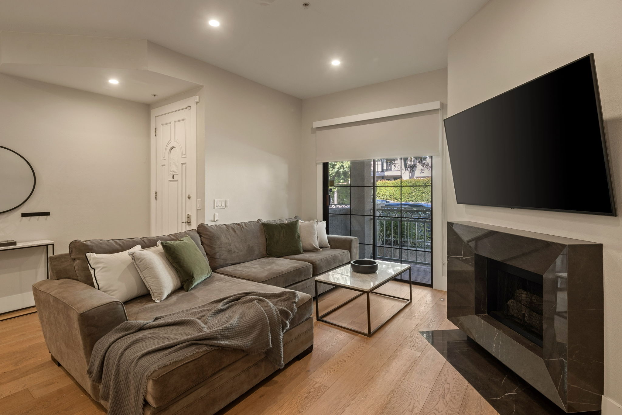 241 S Lasky Drive &mdash; living room with fireplace and media wall