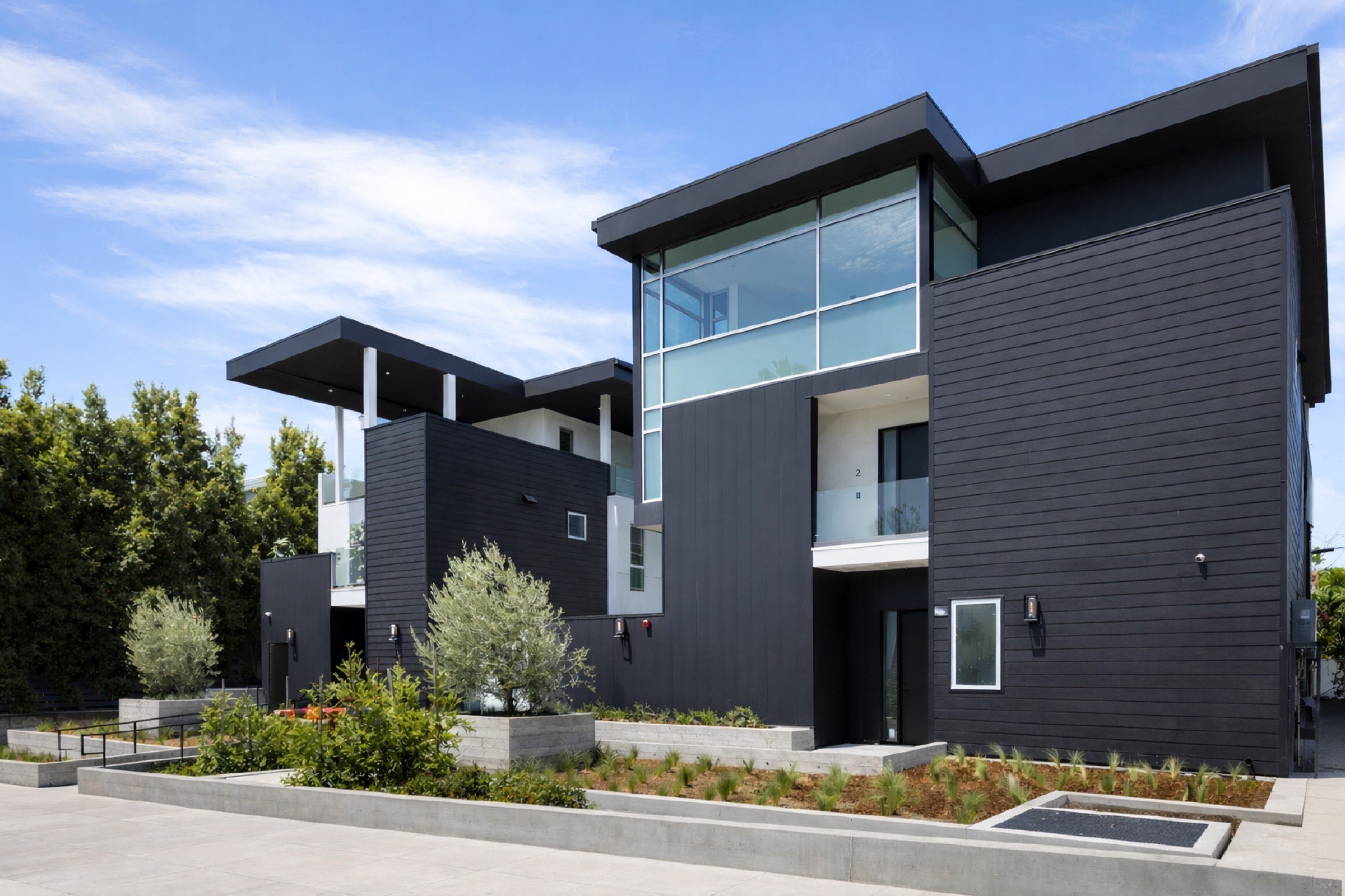 Crescent Heights — street elevation of the two dark-clad residences