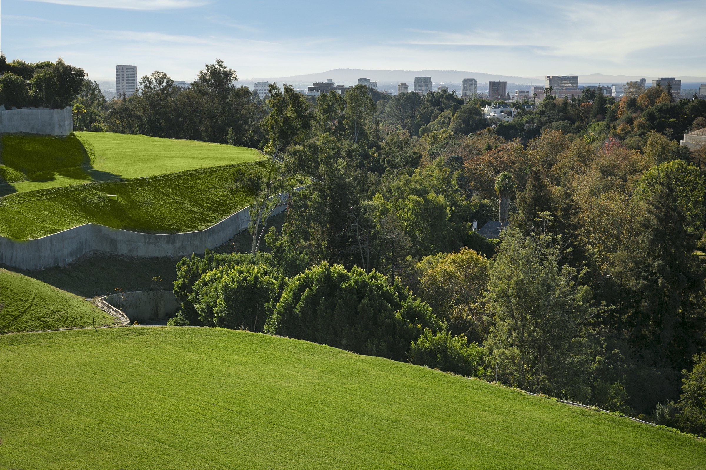 Tortuoso Way — sunset view across the lawn toward the Los Angeles skyline